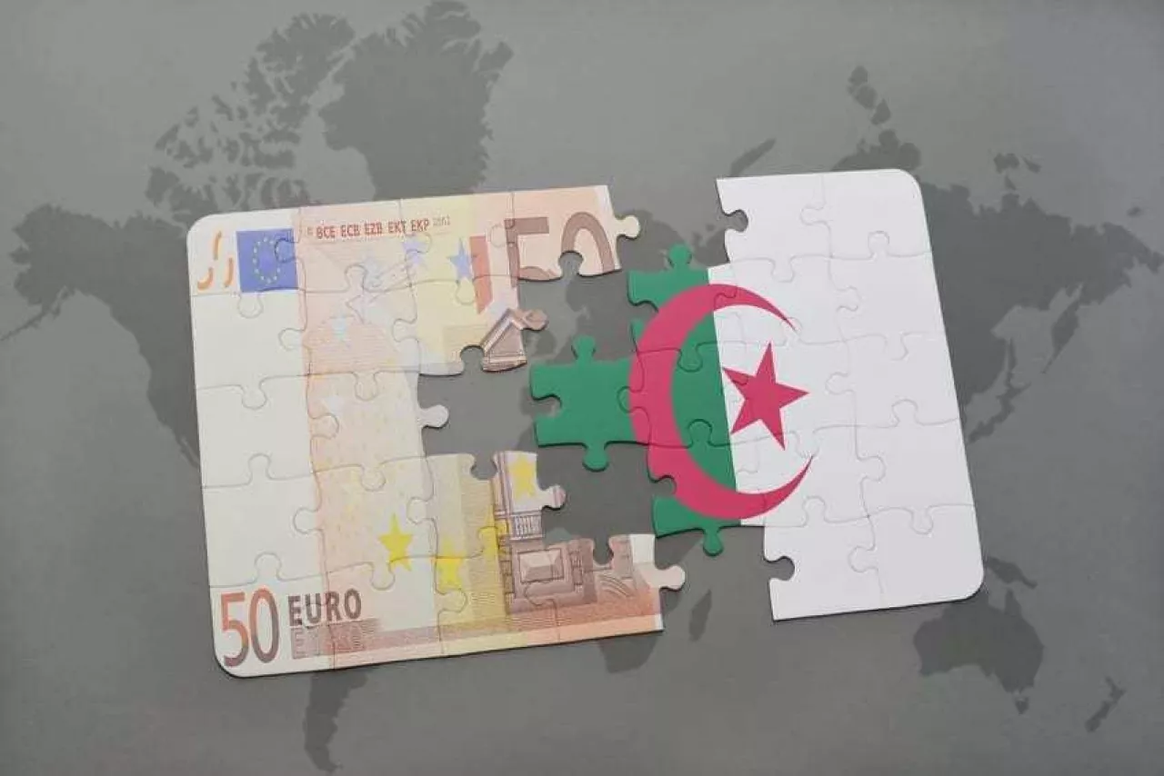 puzzle with the national flag of algeria and euro banknote on a world map background. 3D illustration