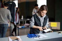 A group of volunteers working in community charity donation center.