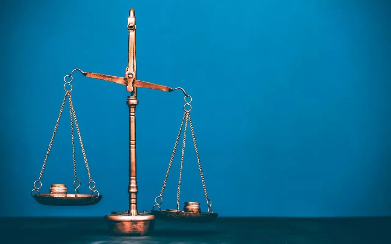 Balance scale with coin stacks. Money management, time value of money and saving money concept.