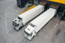 Two trucks loading in the distribution hub