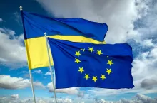 Ukrainian blue and yellow bicolor national flag on blue sky background. Ukraine fight for Freedom concept