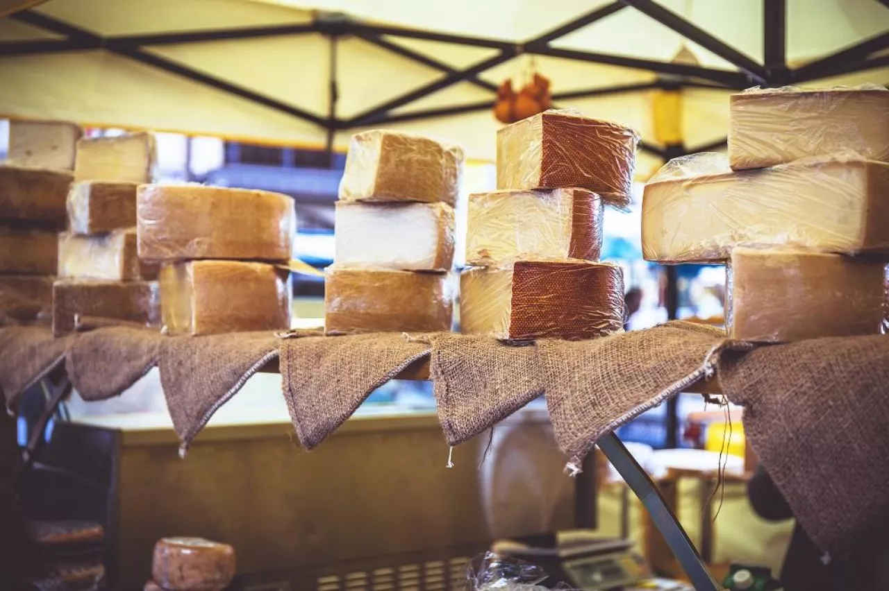 Farmers cheeses in the city market in Basel. Low shallow focus. Toned