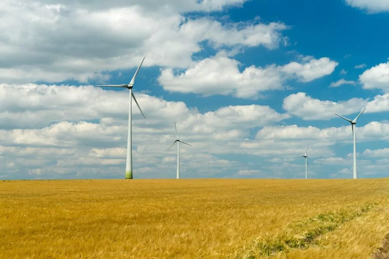 Eolian generators in a beautiful wheat field. eolian turbine farm,wind turbine, wind field with wind turbines. Wind propeller. Wheat Fiel Agriculture.